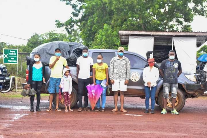 Minister of Amerindian Affairs, Pauline Sukhai shares a photo moment with residents in Region Eight