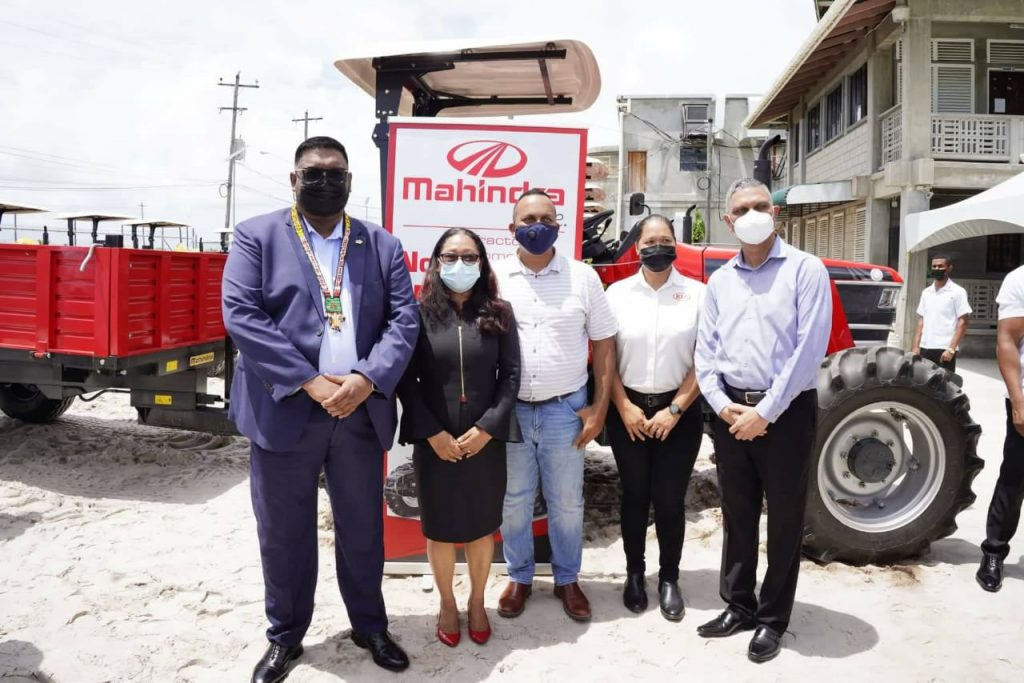 H.E President Mohamed Irfaan Ali and Minister Pauline Sukhai with Supplier of the tractors, Rudisa Moto Company Inc