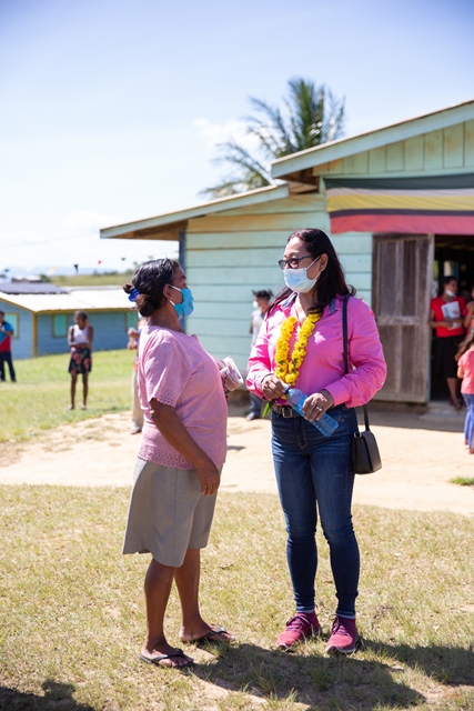 Minister of Amerindian Affairs Pauline Sukhai interacts with a resident of Kurukubaru, Region Eight