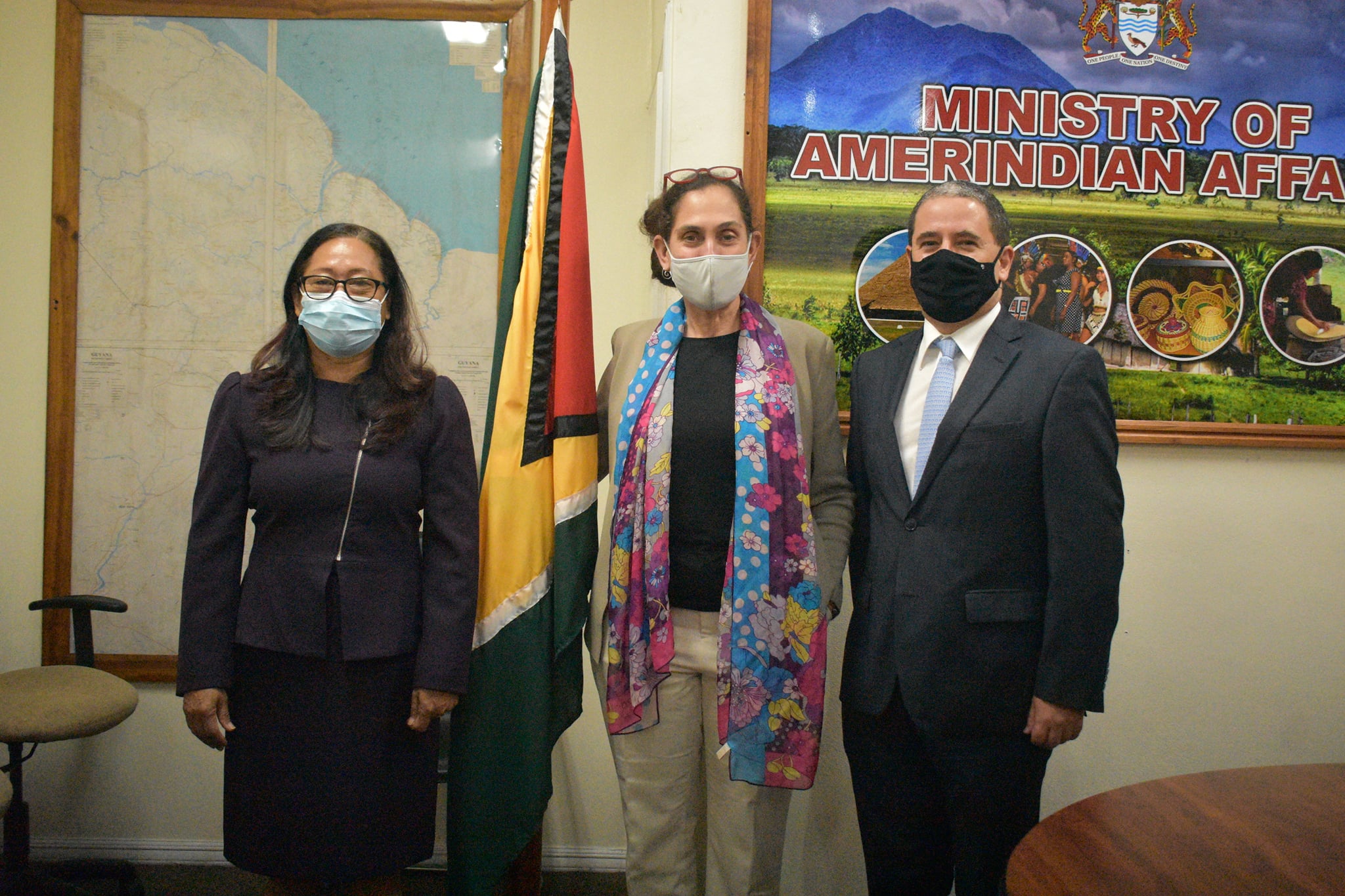 Minister of Amerindian Affairs, Hon. Pauline Sukhai shares a photo moment with newly appointed UN Resident Coordinator Ms. Yesmin Oruc and a colleague.